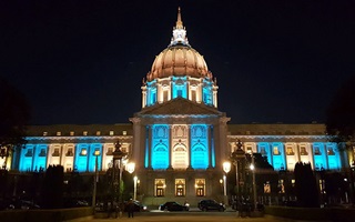 state-builindg-lit-blue-for-pf-awareness-month