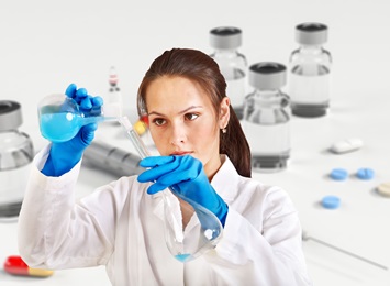 woman researcher filling test tubes