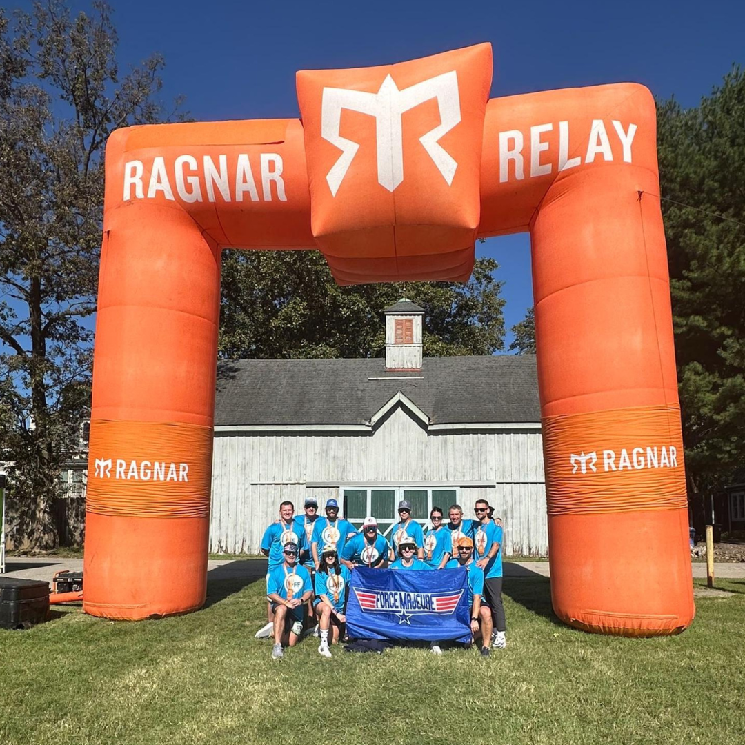 Group of runners posing for picture