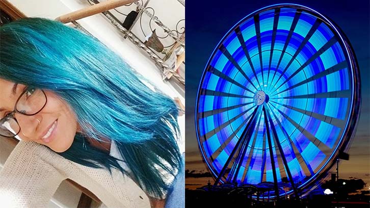woman-with-long-blue-hair-next-to-a-blue-Ferris-Wheel