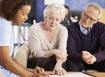 nurse-talking-to-patient-and-caregiver