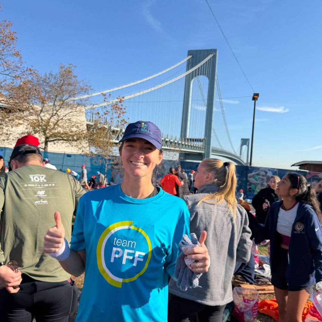 Female athlete posing for picture in front of Golden Gate bridge