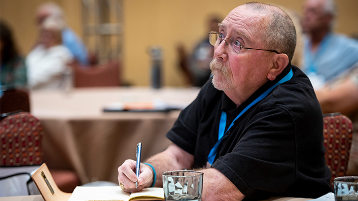 Man writing in notebook