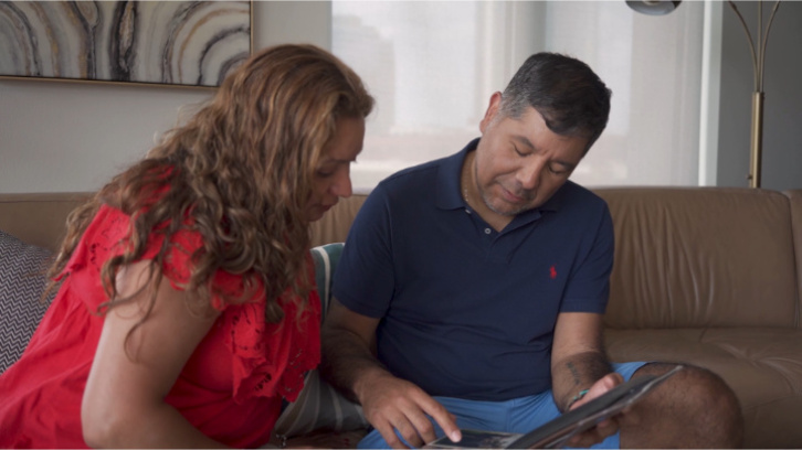 brother-and-sister-looking-through-photo-albums