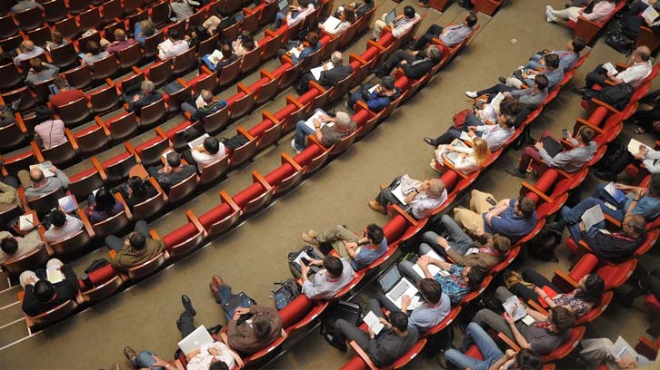 people-gathered-in-an-auditorium