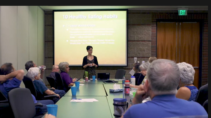 nurse-providing-a-support-group-presentation