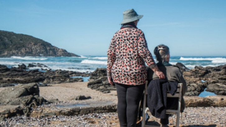 two-women-on-the-beach-enjoying-the-view