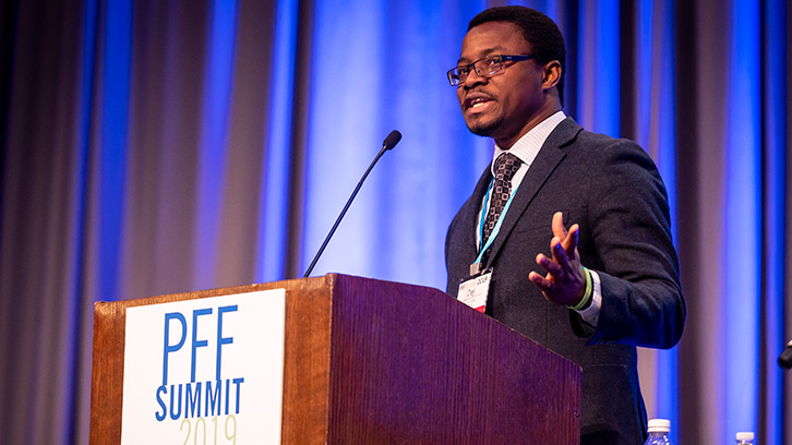 Man presenting research at conference