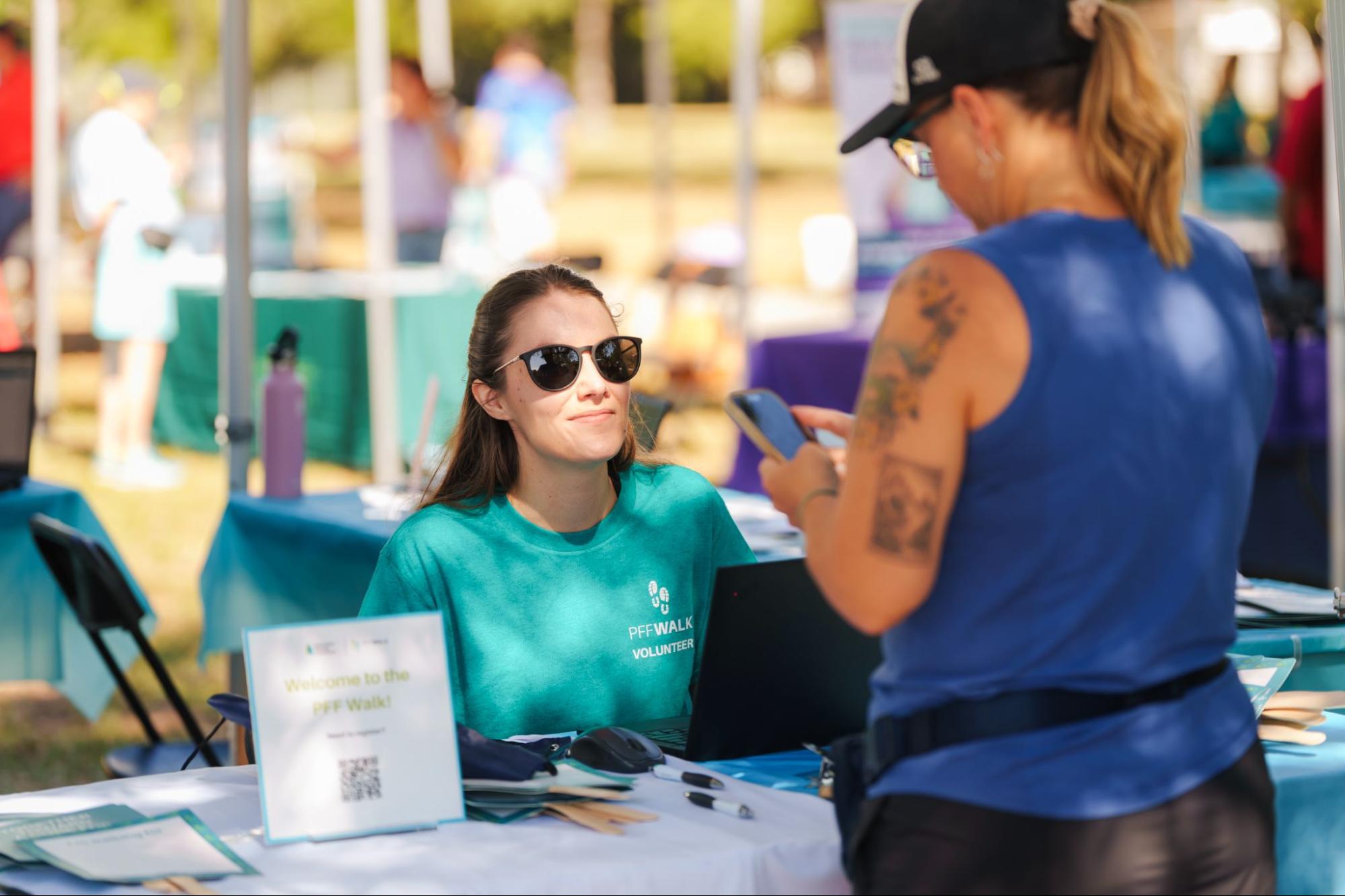 PFF walk, woman checking in at registration