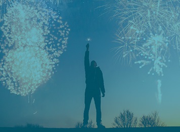 person-with-fireworks-behind-them